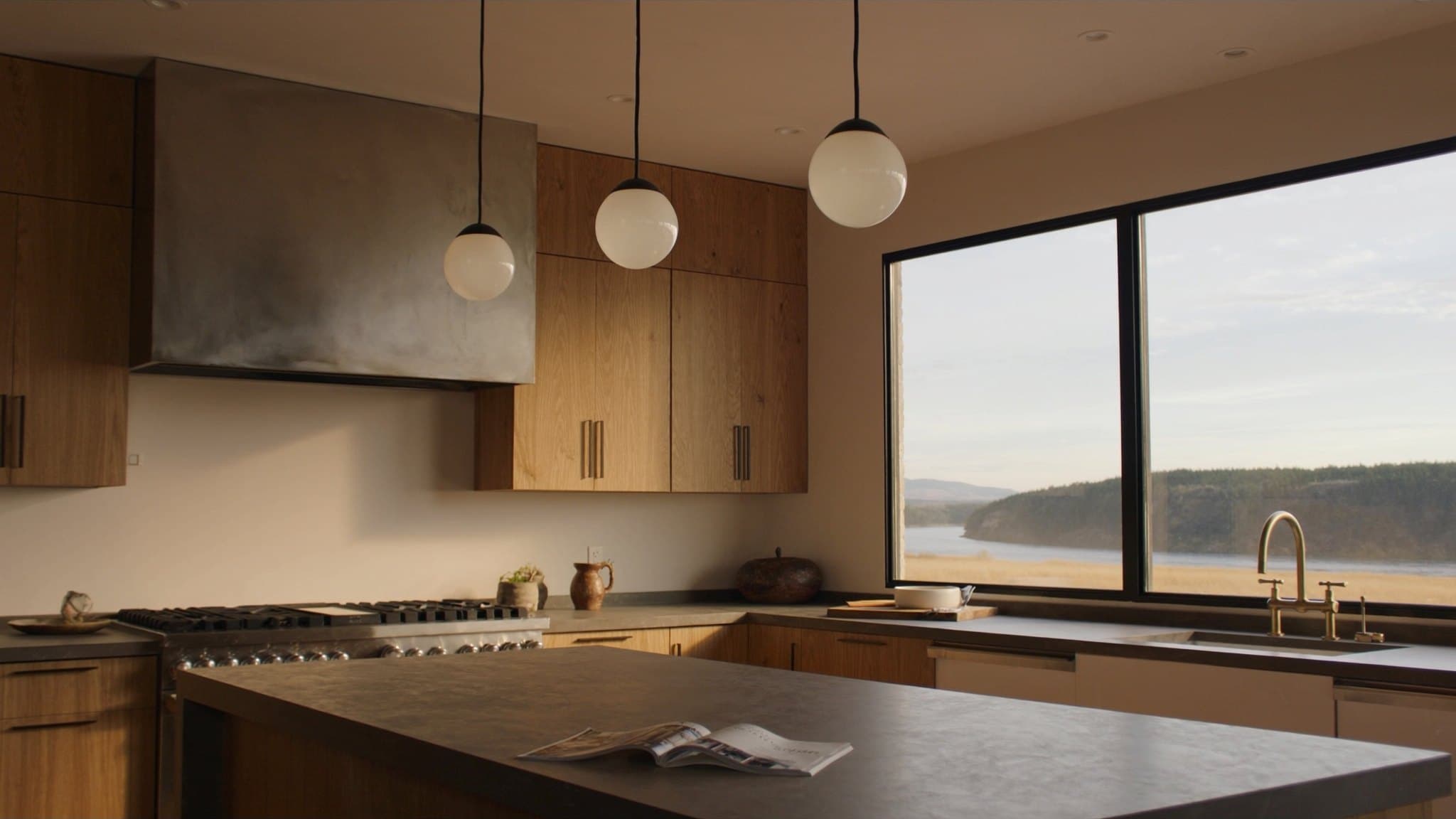 Render: kitchen with soapstone island, white-oak open shelving, brass tapware