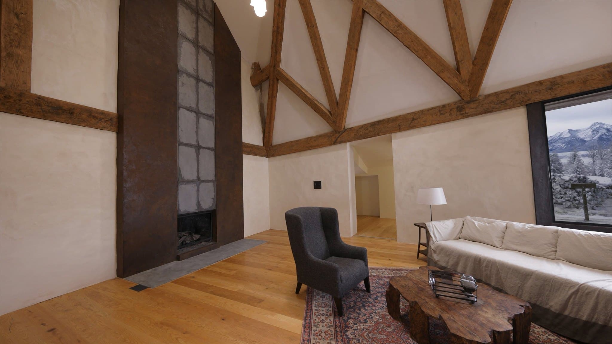 Render: living room with wide picture window onto the river bend