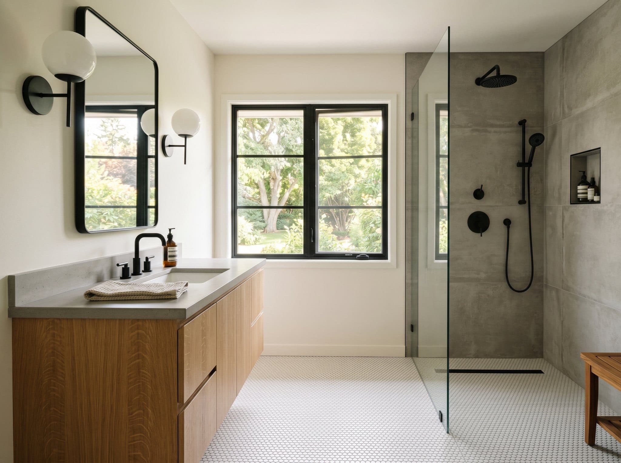 Render: renovated bath with penny-round mosaic floor, rift-cut white-oak vanity, matte-black tap